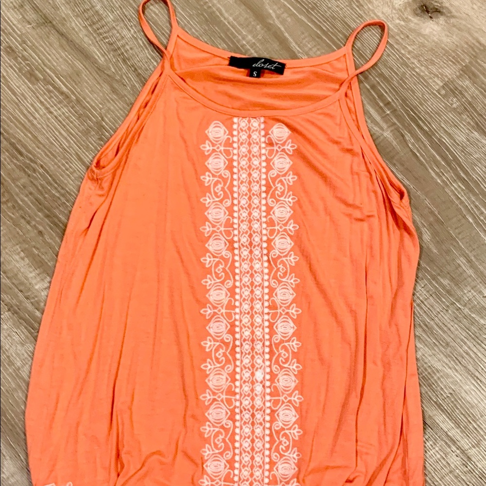 Orange tank top with white embroidery
